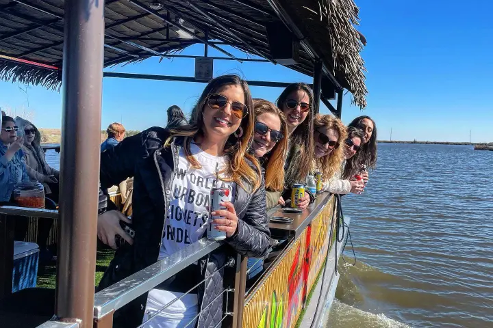 a group of people in a boat on a body of water