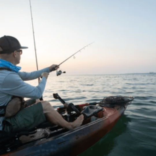 a man riding on the back of a boat