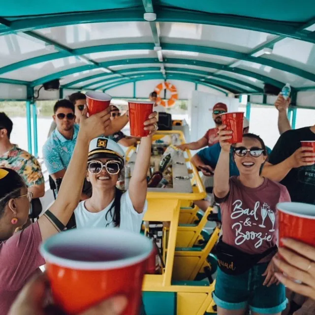 a group of people standing next to a cup of coffee
